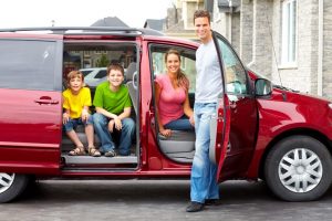 7088156 - smiling happy family and a family car