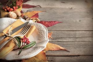 44237567 - autumn rustic table setting with berries, leaves, acorns and nuts